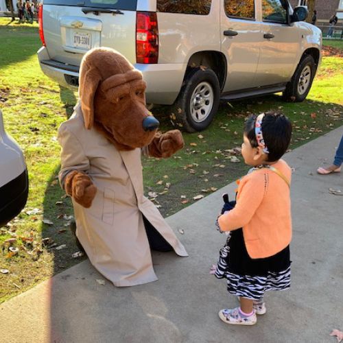 child talking with person in costume
